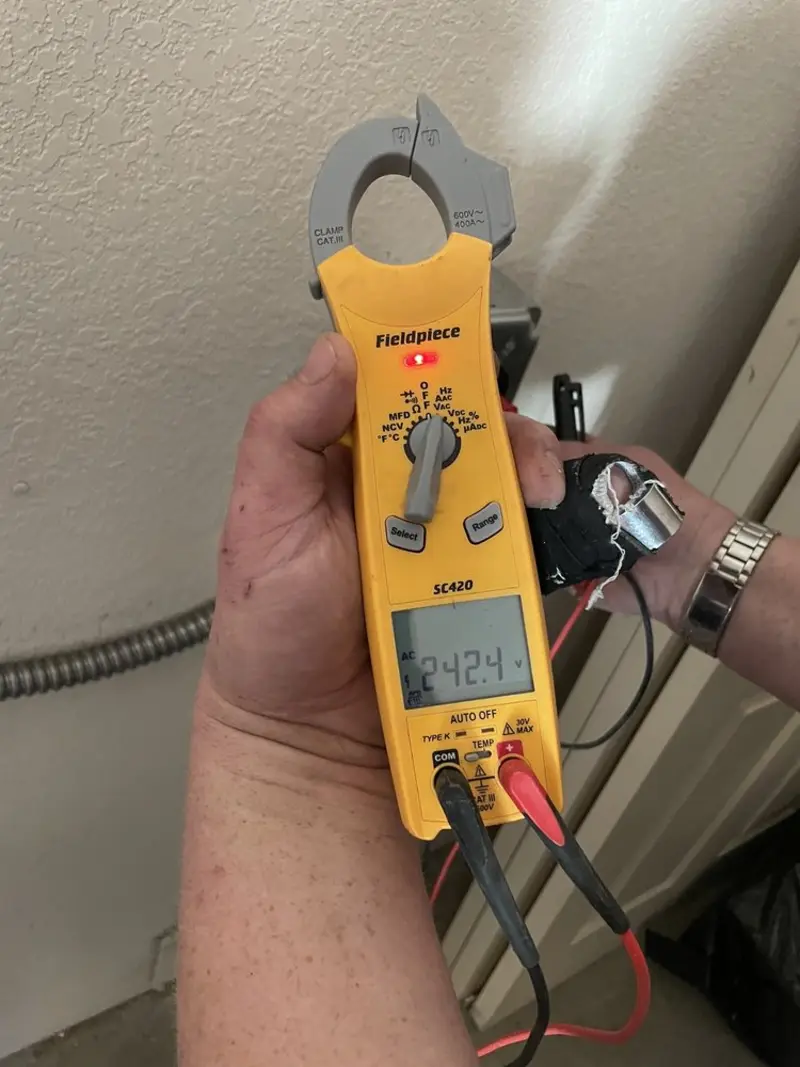 Voltage testing with clamp meter during Outlet Installation in Cornville